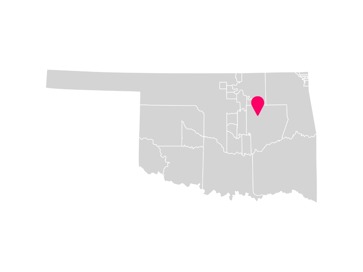 A gray map of Oklahoma's Tribal Jurisdictions with Sapulpa, Oklahoma marked with a pink pin where the Yuchi Tribe's Headquarters is located inside the Muscogee (Creek) Nation.