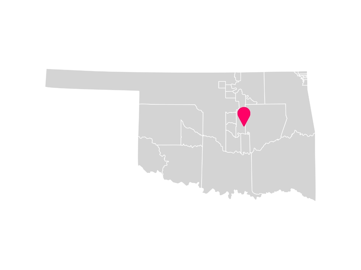 A gray map showing the tribal jurisdiction areas of Oklahoma with a pink pin marking Stroud, Oklahoma, where the Sac & Fox Nation is headquartered.