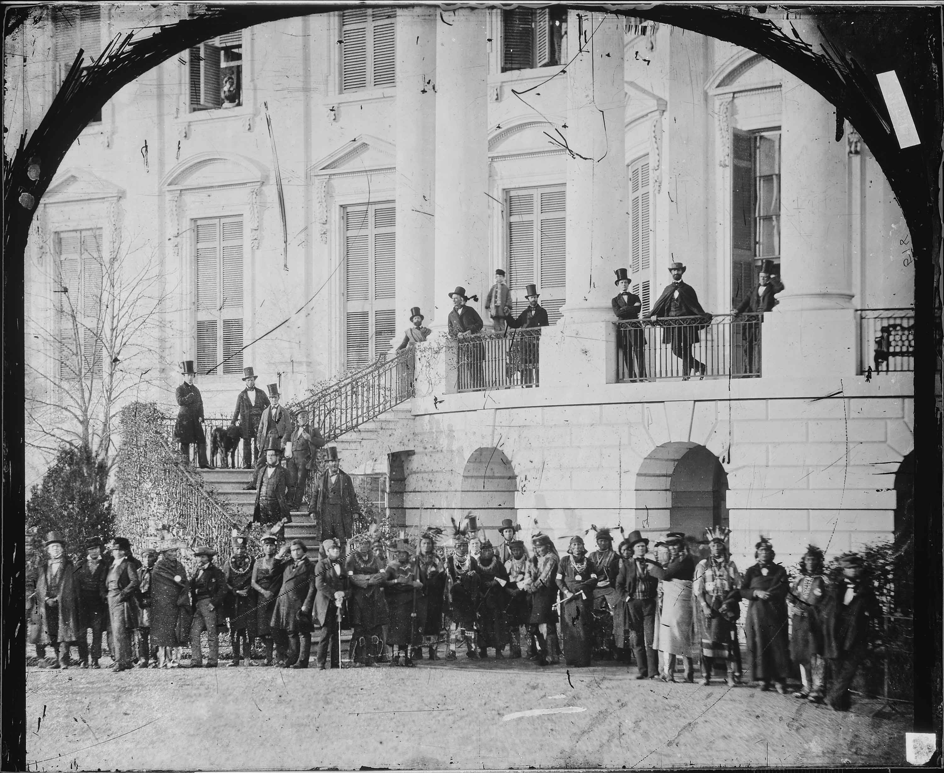 Historic photograph of Native delegates standing in front of the White House.