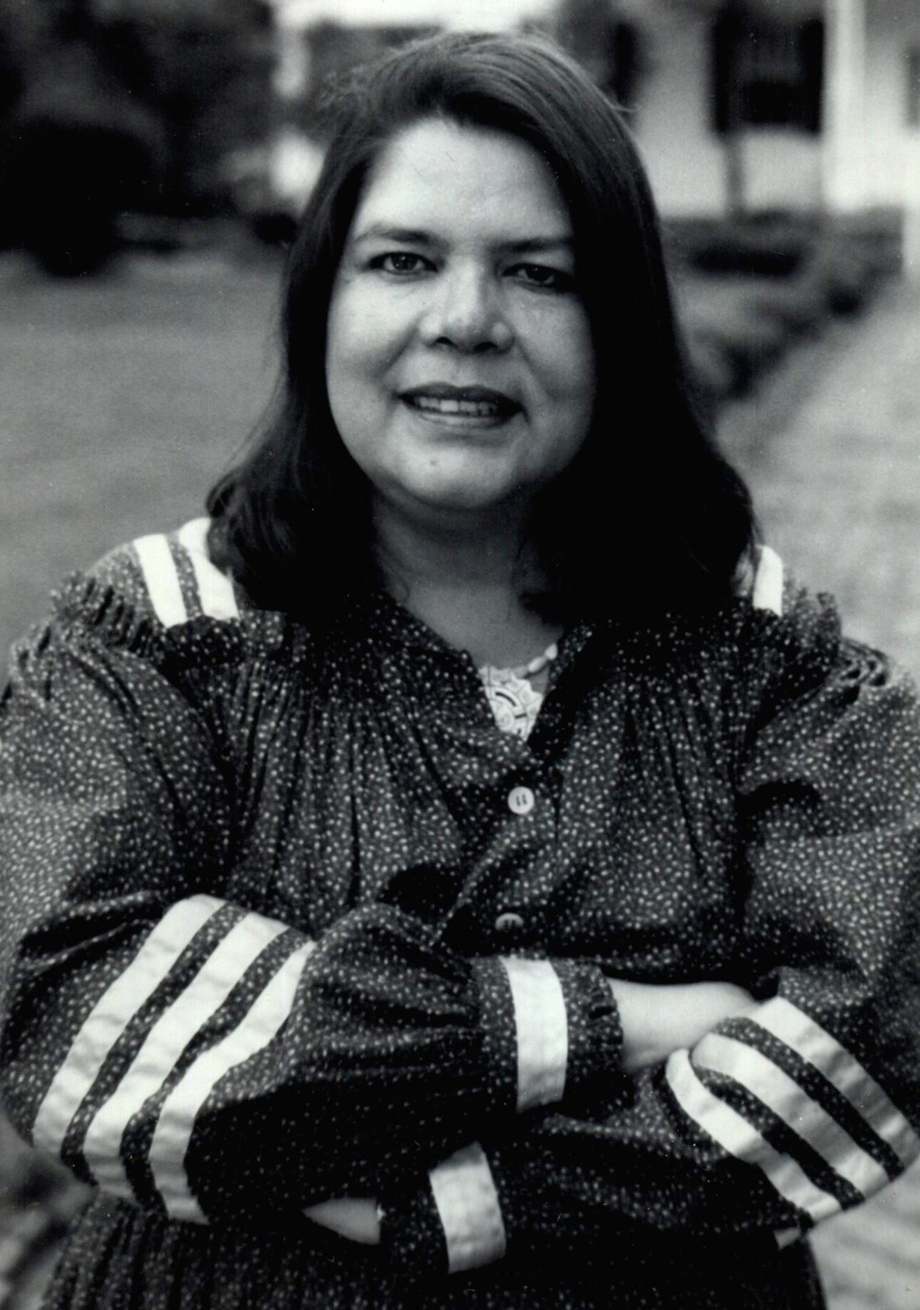 Black and white portrait photograph of Principal Chief Wilma Mankiller.