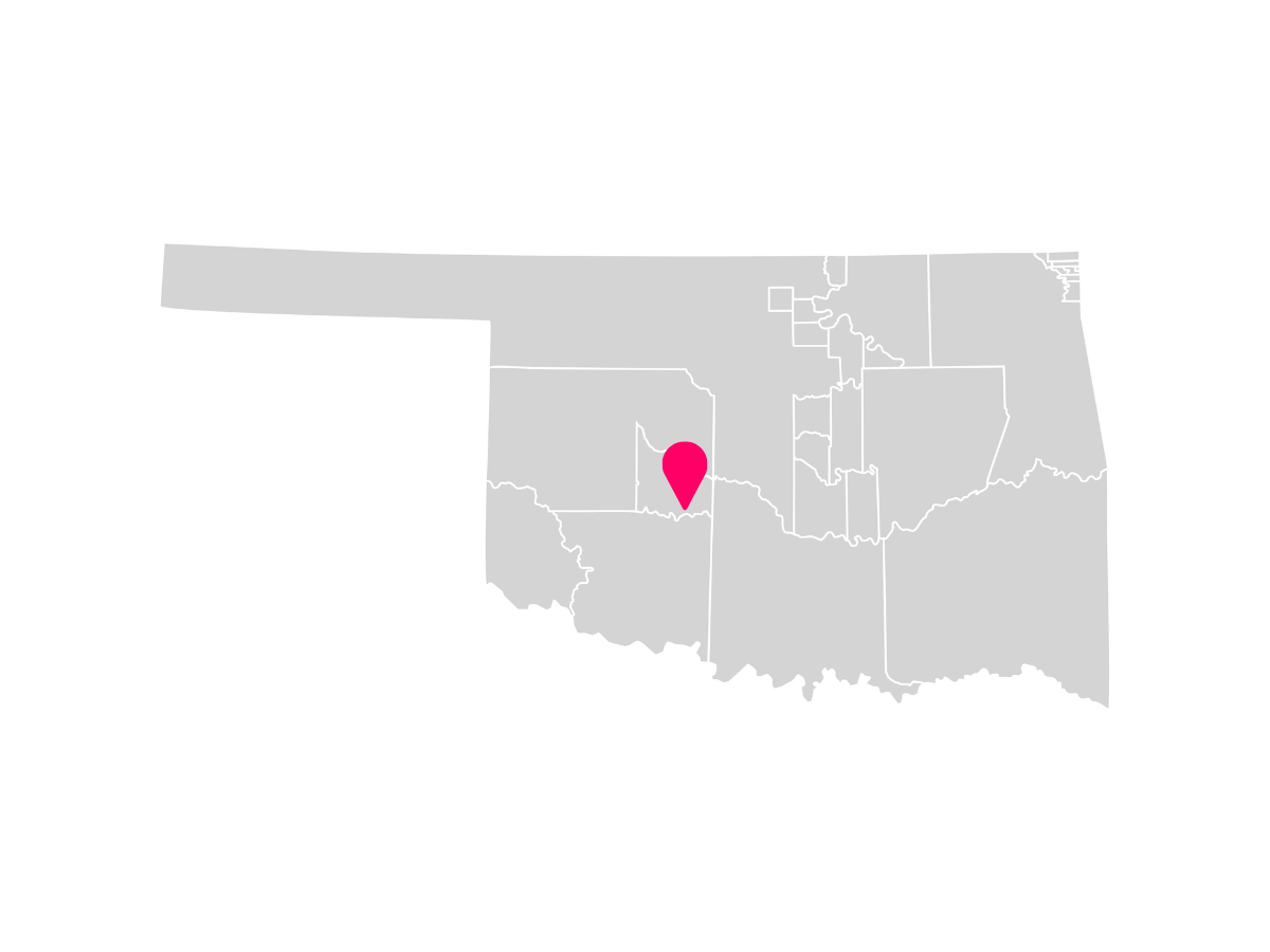 A gray map showing the tribal jurisdiction areas of Oklahoma with a pink pin marking Anadarko, Oklahoma, where the Delaware Nation is headquartered.