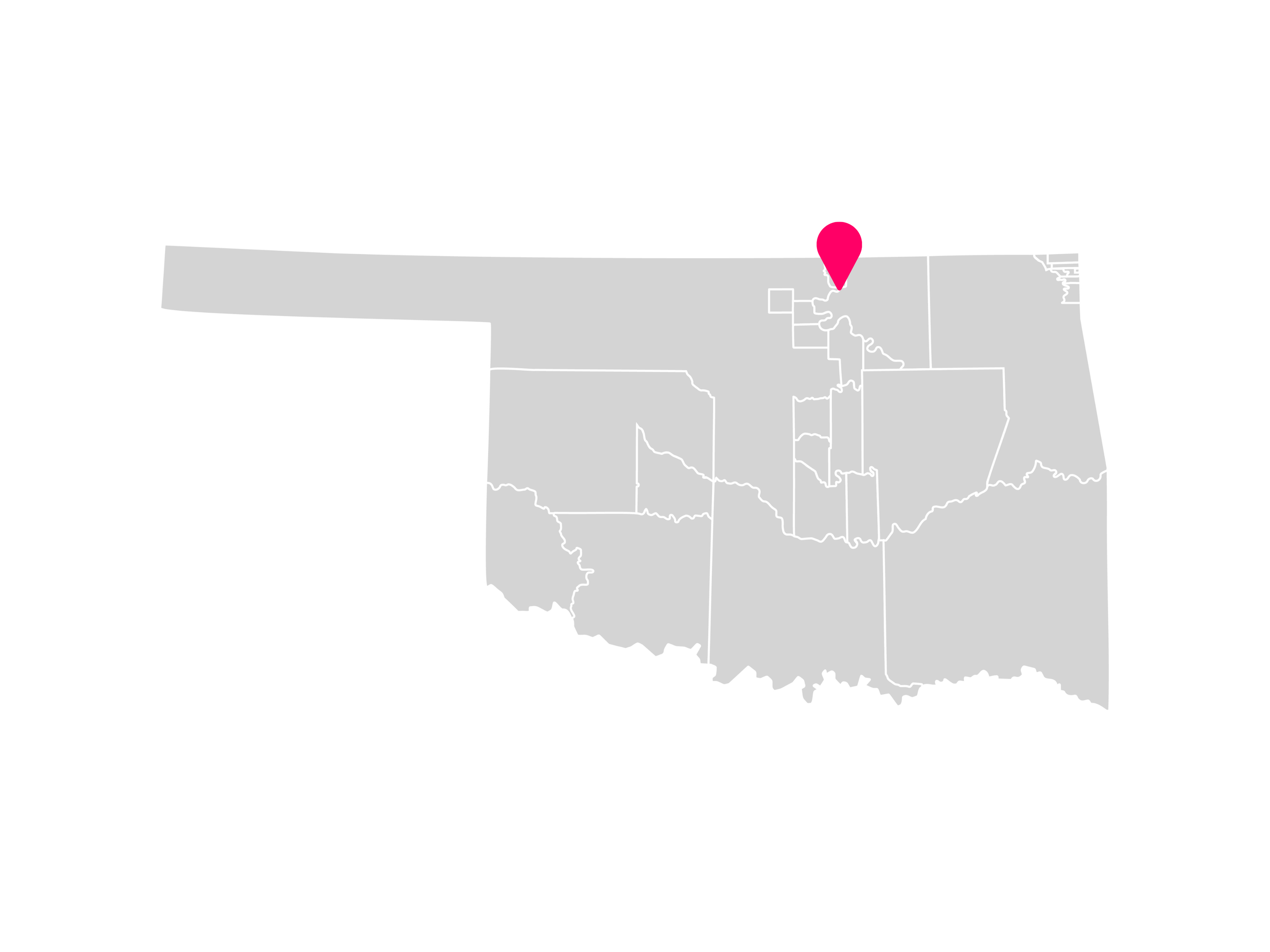 A gray map showing the tribal jurisdiction areas of Oklahoma with a pink pin marking Kaw City, Oklahoma, where the Kaw Nation is headquartered.