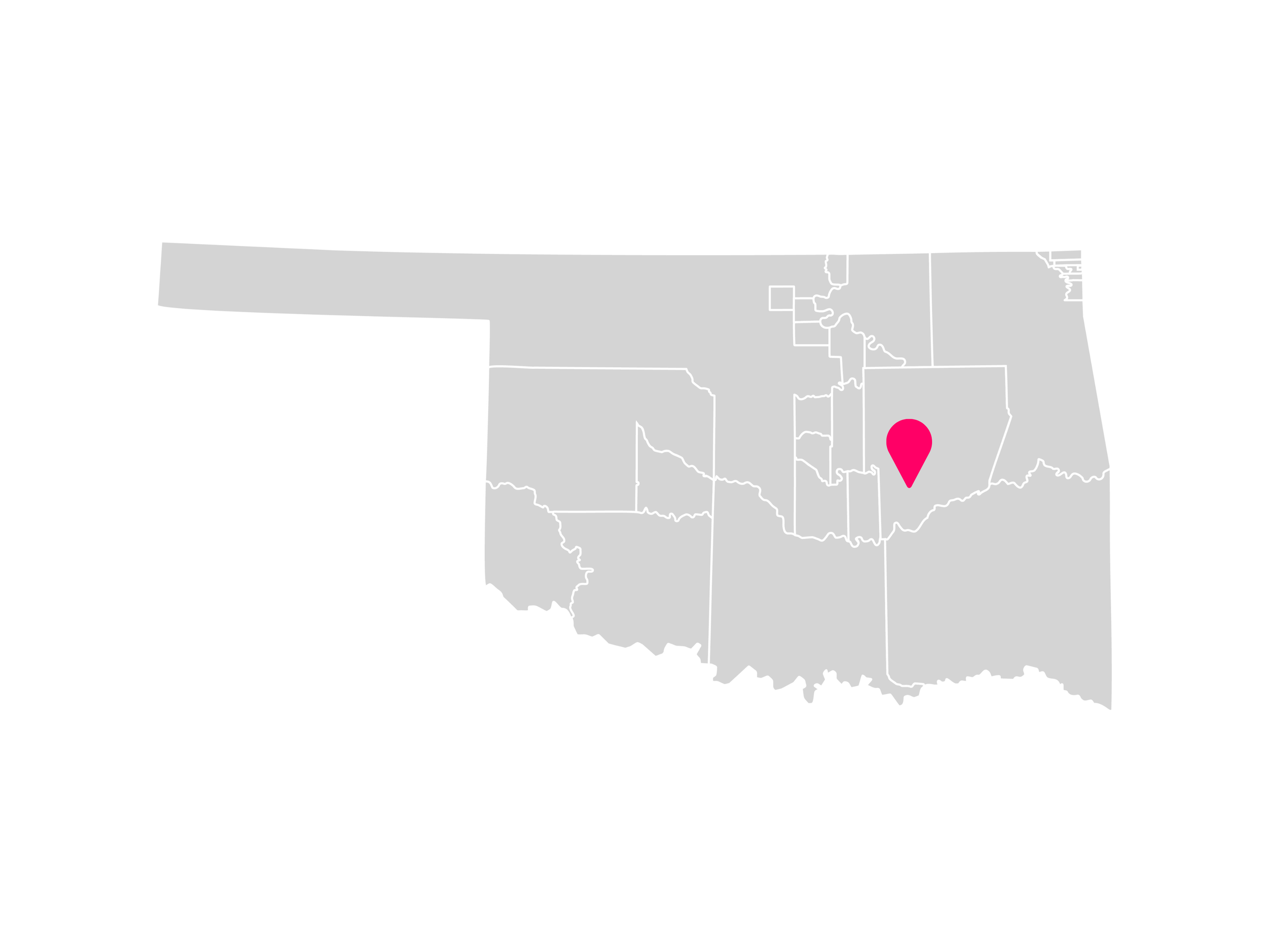 A gray map showing the tribal jurisdiction areas of Oklahoma with a pink pin marking Wetumka, Oklahoma, where the Kialegee Tribal Town is headquartered within the Muscogee (Creek) Nation.
